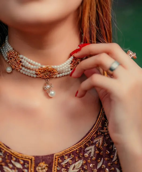 Close-up of a gold necklace with pearls